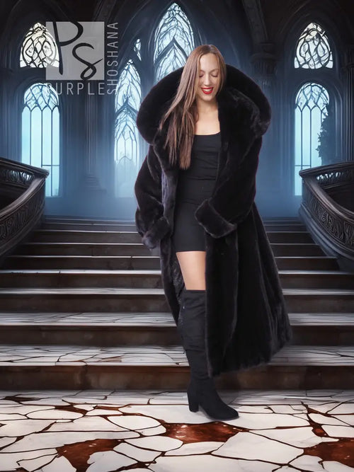 Black long hooded fur coat with open front and full sleeves, front view standing with coat draped