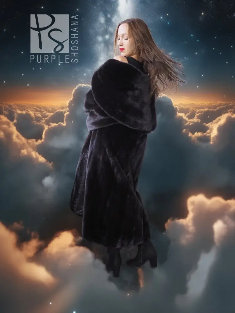 Black hooded long mink coat with silk lining; back view shows hood and full skirt.
