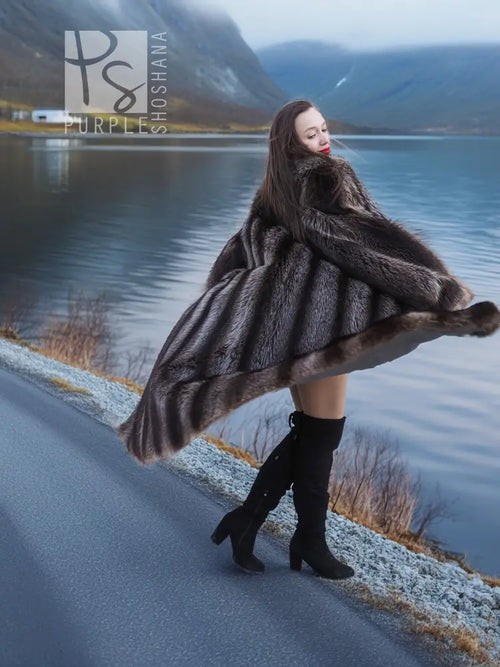 Long raccoon fur coat with broad fur sleeves, dark gray finish and open front detail
