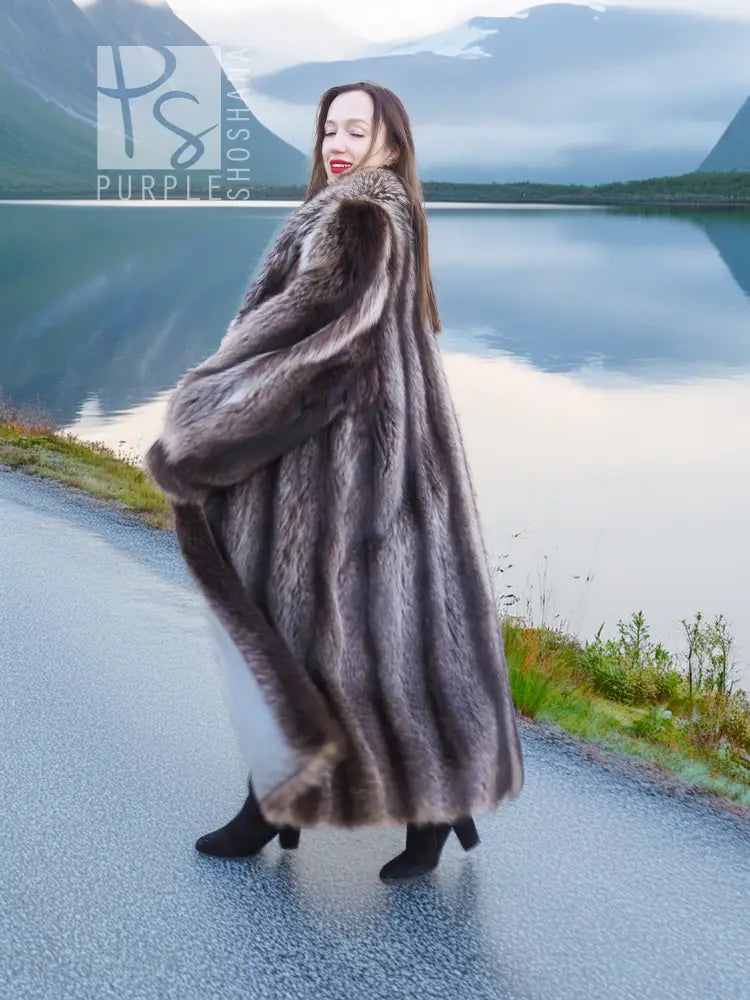 Dark gray-brown hooded raccoon fur coat, side view with textured sleeves and hem