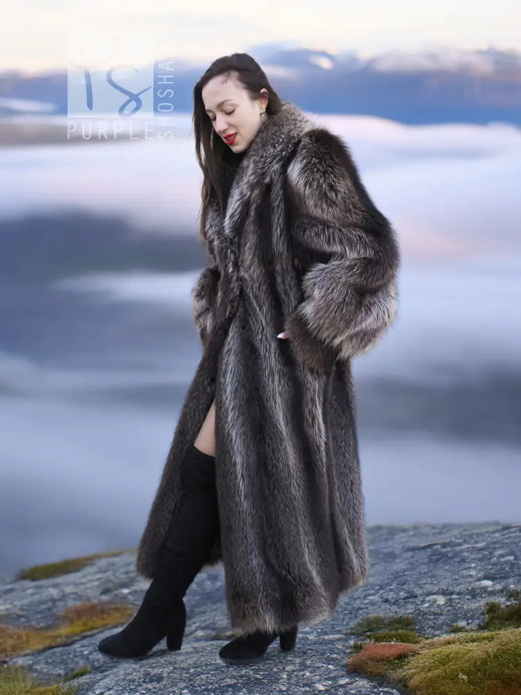 Long raccoon fur coat with draped front panels, dark gray fur and flared sleeves