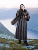 Raccoon fur coat with buttoned front, long dark fur and shawl collar