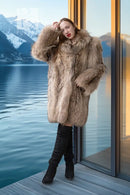 Mid-length raccoon fur coat in golden honey and chestnut hues, side profile