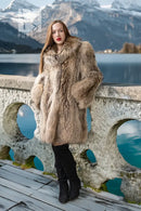 Honey raccoon fur coat with high collar and full, flowing silhouette in chestnut tones