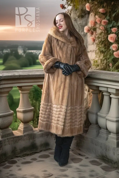 Tan mink fur coat with hooded collar and ribbed hem; black gloves and dark boots