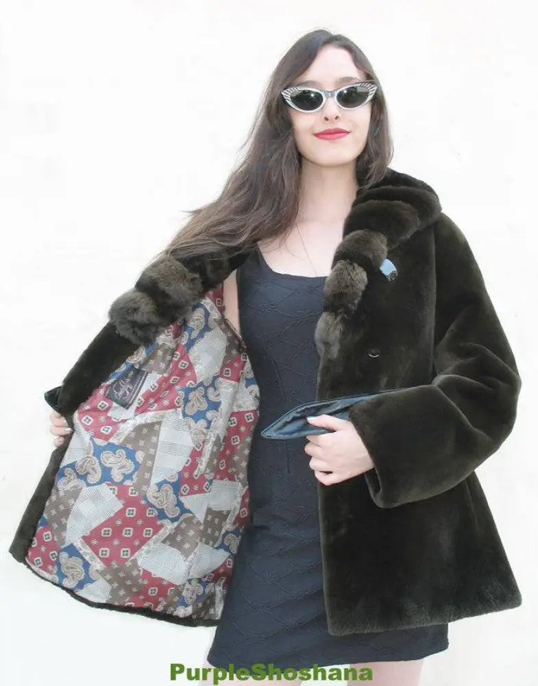 Women's dark fur coat with chinchilla trim, belted waist and open front