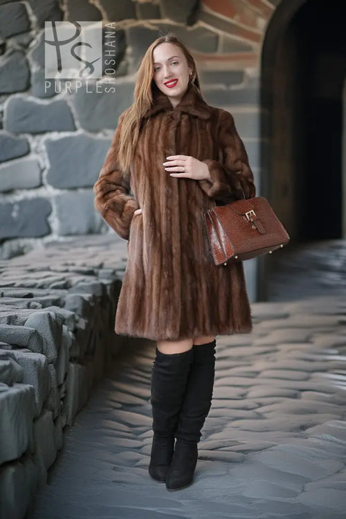 Brown demi-buff mink stroller coat with plush vertical fur texture and shawl collar