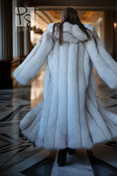 Hooded plush faux fur coat in pale blue, back view with wide hood and gathered hem