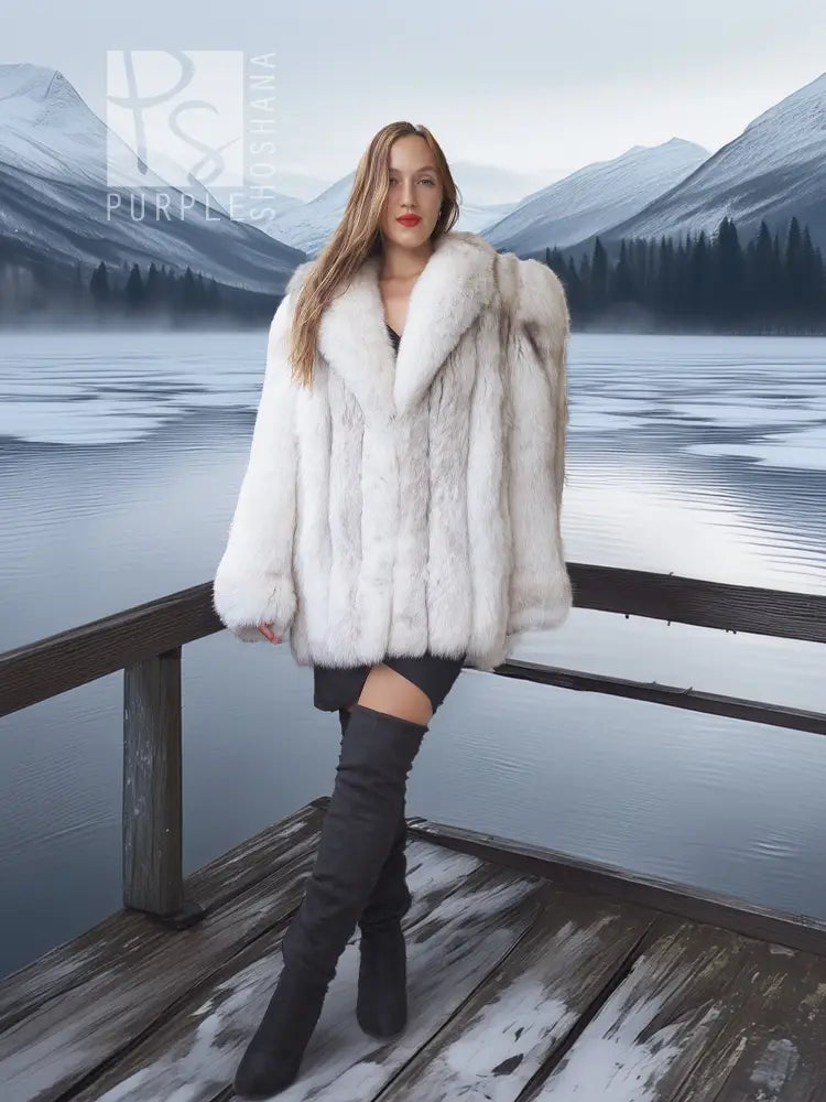 White faux fur shawl-collar coat with voluminous sleeves and cropped front length.
