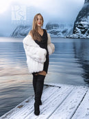 White faux fur shawl-collar coat with full skirt-like shape and short cropped hem.