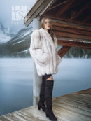 Pale white fox fur coat with shawl collar, side view with draped sleeves