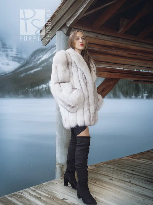 Pale white fox fur coat with shawl collar, side view with draped sleeves