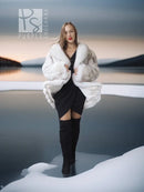 Pale white fox fur coat with shawl collar, open front over dark dress