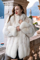 Ivory plush faux fur jacket with high collar and long cuffed sleeves