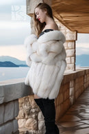 White plush fur jacket with long sleeves and open front, cropped hem