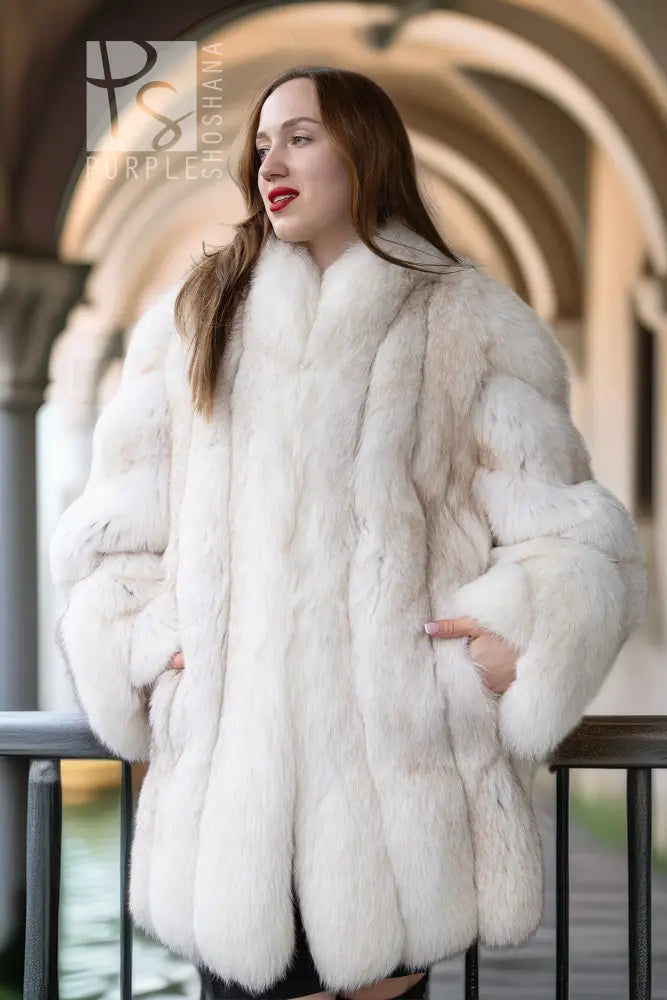 White plush fur jacket with tall collar and long sleeves, front view