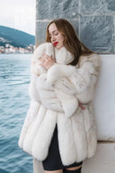 White plush fur jacket with textured fur pattern and long sleeves, side view