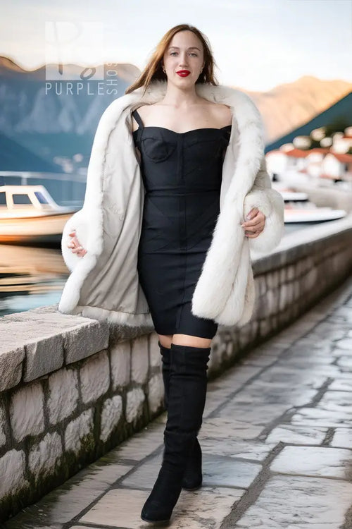 White plush fur jacket with draped open front and fluffy, textured cuffs