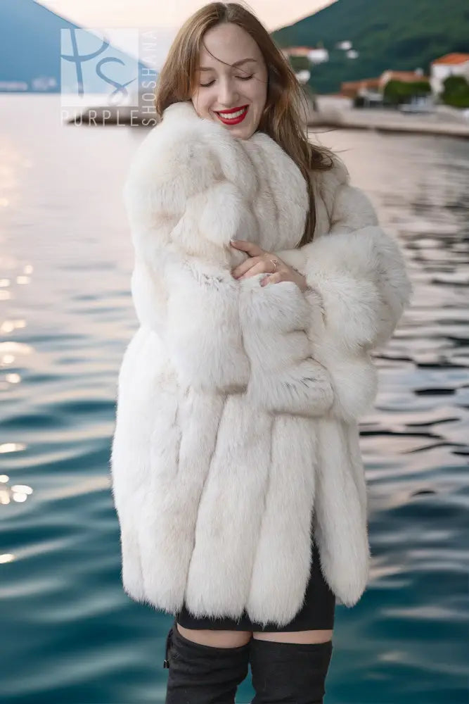 Ivory faux fur jacket with plush body, long sleeves, and open front