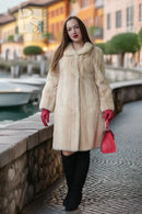 Ivory faux mink coat with long sleeves, button-front closure, and mid-calf length