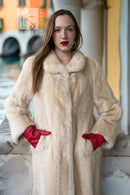 Ivory faux mink coat close-up showing lapel-style collar and textured button detail