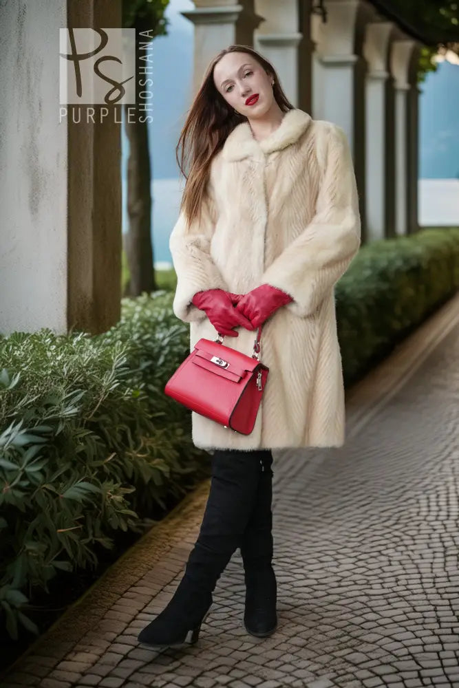 Ivory faux mink coat front view with thick collar, fitted waist, and button closure
