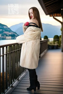 Ivory mink coat, side view with plush texture and draped open-front look.