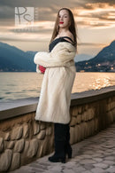 Ivory mink coat with thick collar and red gloves, mid-thigh length