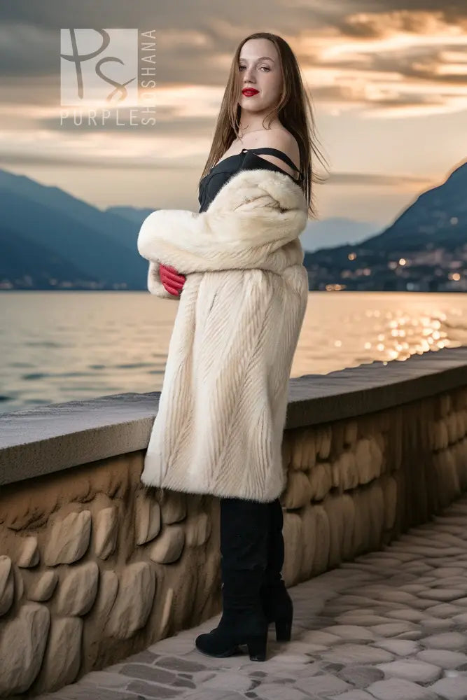 Ivory mink coat with thick collar and red gloves, mid-thigh length