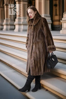 Brown mink swing coat with plush texture, side profile and fur cuffs