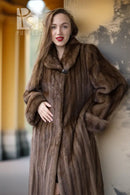 Tan mink coat with shawl collar and button-front placket, close-up