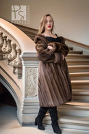 Mink fur coat with swing silhouette, wide collar, and large rosette trim in dark brown