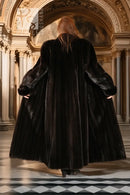 Black mink coat back view, wide sleeves and full-length hem
