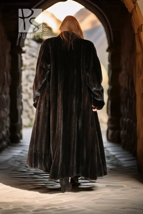 Black mink coat back view with horizontal fur paneling and full skirt