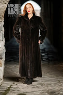 Black mink coat, long length with pointed collar and button front.