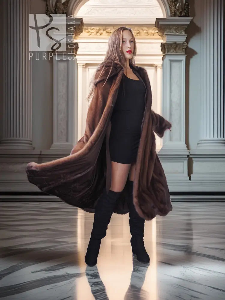 Dark brown hooded mink swing coat with swing hem over black dress and boots