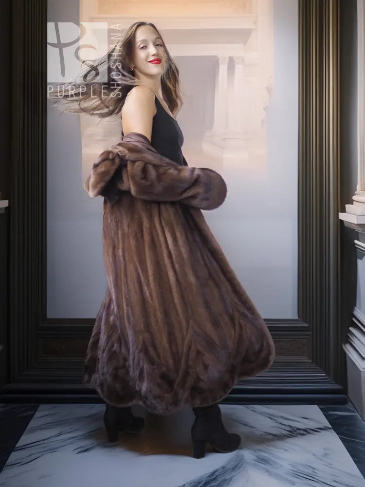 Dark brown mink swing coat with voluminous sleeves and rounded silhouette