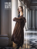 Dark brown mink swing coat with open front and thick cuff details, side view