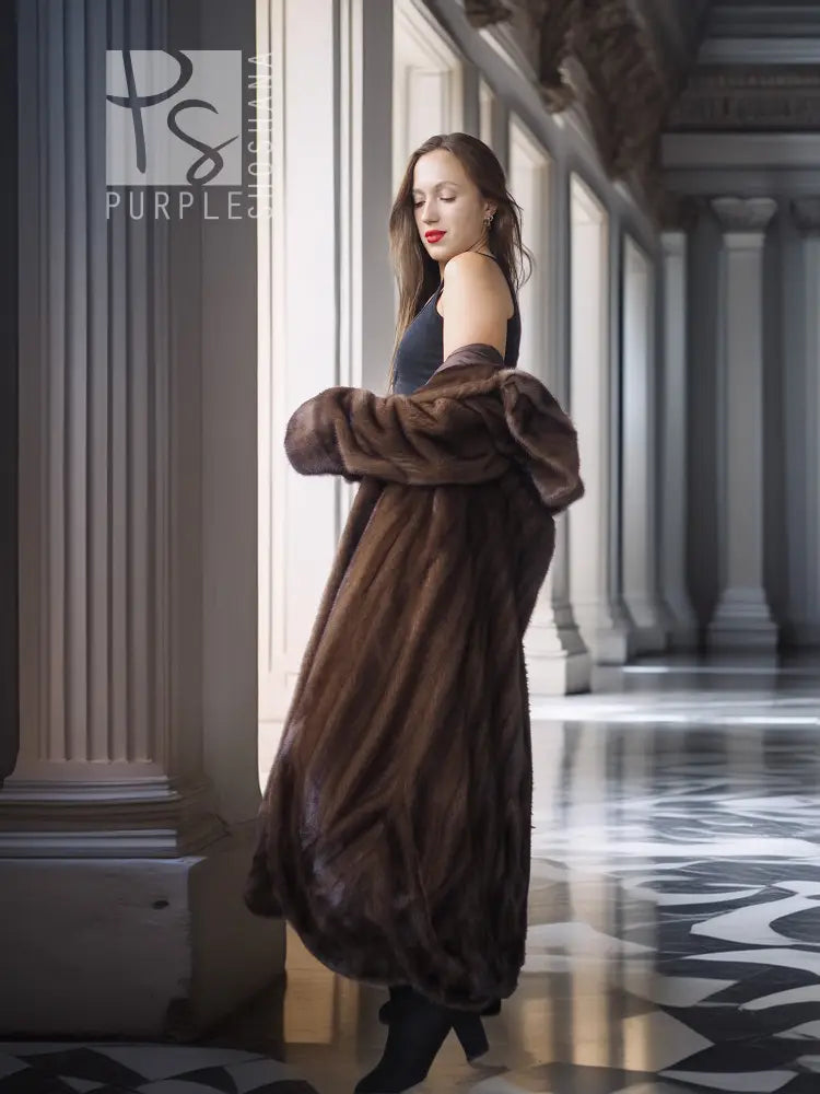 Dark brown mink swing coat with open front and thick cuff details, side view