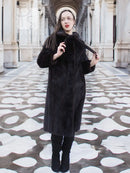 Long mink fur coat with wide collar and buttonless front, dark color
