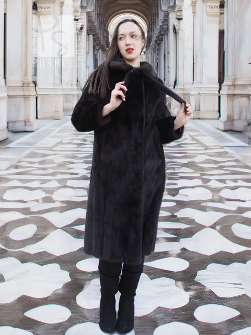 Long mink fur coat with wide collar and buttonless front, dark color
