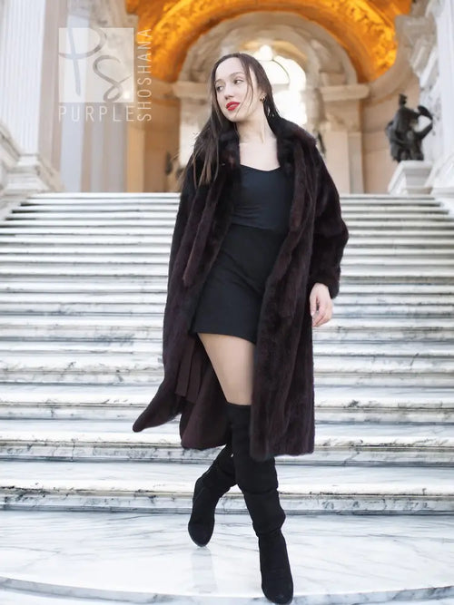 Long mink fur coat with tie belt and wide collar, buttonless front with draped fit