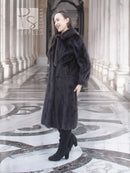 Dark mink fur coat with tie waist, long sleeves, stand collar.