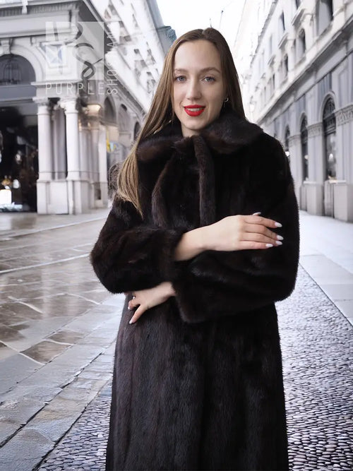 Long mink fur coat with tie belt and high collar, plush textured fabric in front view