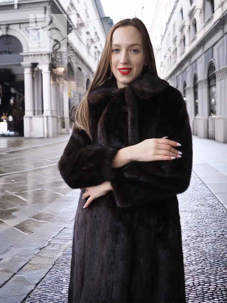 Long mink fur coat with tie belt and high collar, plush textured fabric in front view