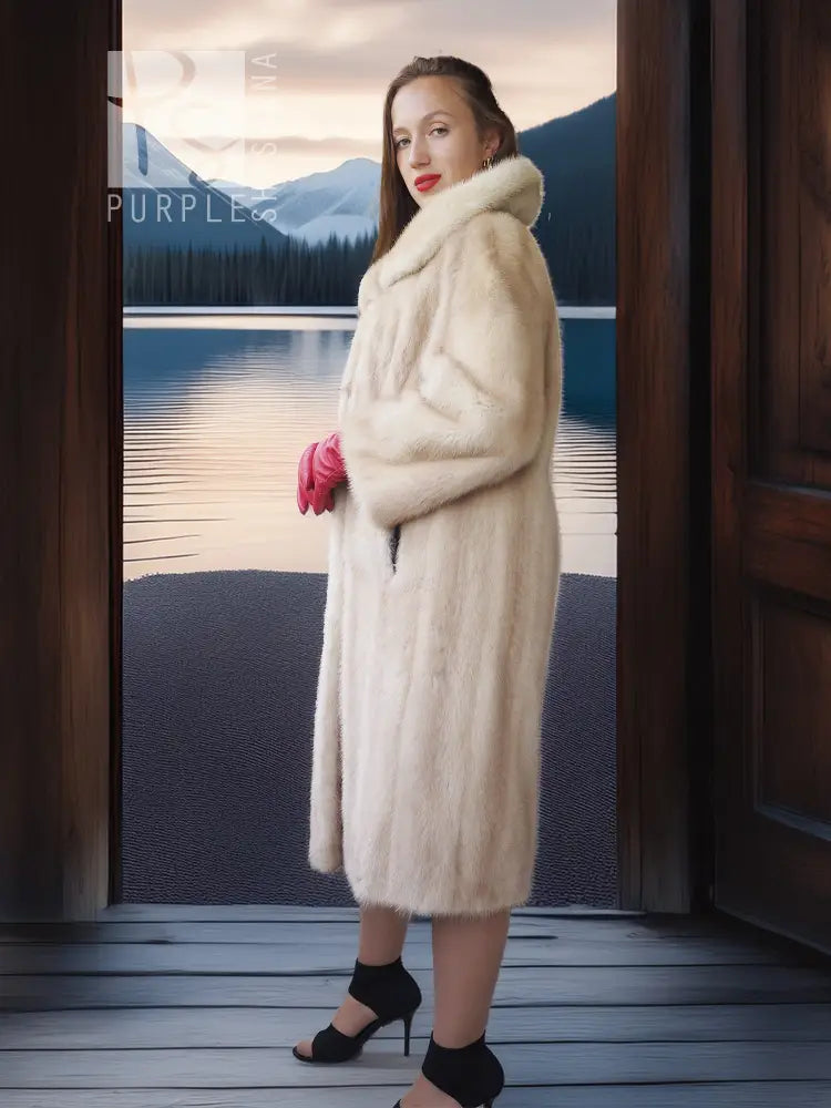 Golden pearl mink fur coat in light cream with wide fur collar, knee length, straight hem.