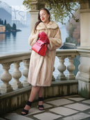 Golden Pearl mink fur coat with shawl collar, long sleeves, cream tone.