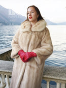 Golden pearl mink fur coat in light cream, knee length, wide fur collar, relaxed fit.