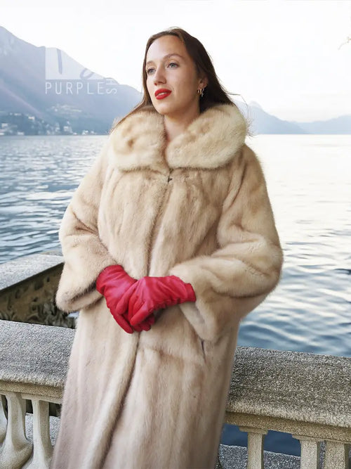 Golden pearl mink fur coat in light cream, knee length, wide fur collar, relaxed fit.