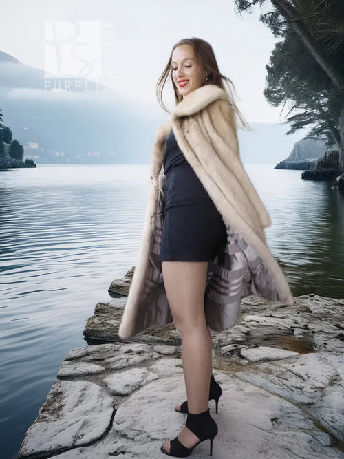 Golden pearl mink fur coat in light cream with wide collar, open front, knee length.